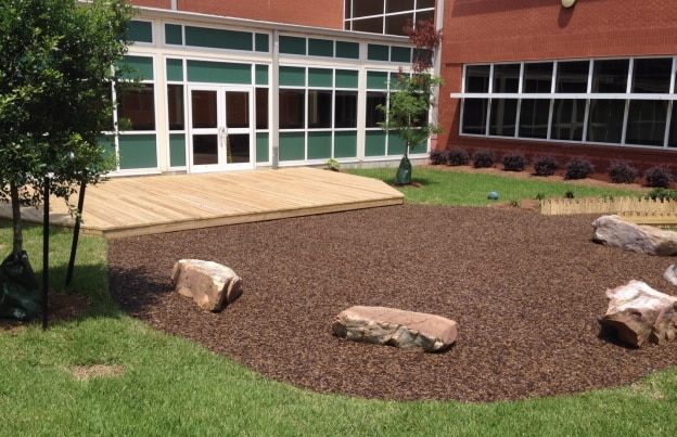 outdoor sitting area with bonded rubber mulch