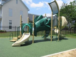 playground in housing development with safety surfacing