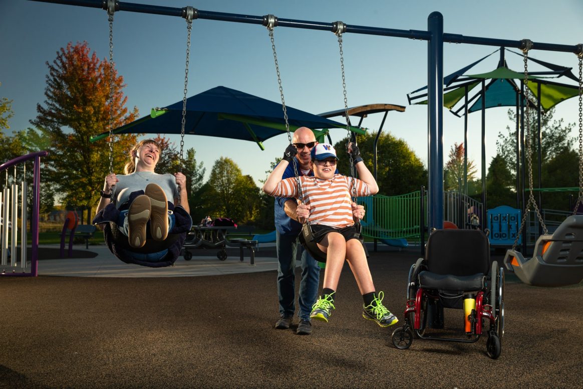 people swinging on playground at Appleton Memorial Park