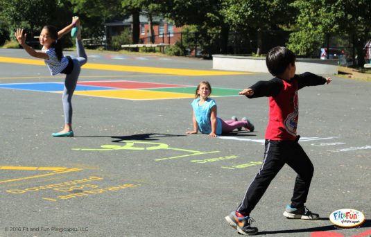 Three kids engaging with Fit and Fun wellness designs on a playground.